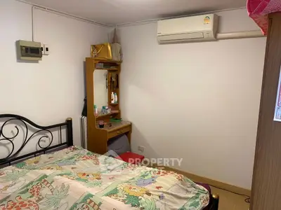 Cozy bedroom with air conditioning and vintage decor