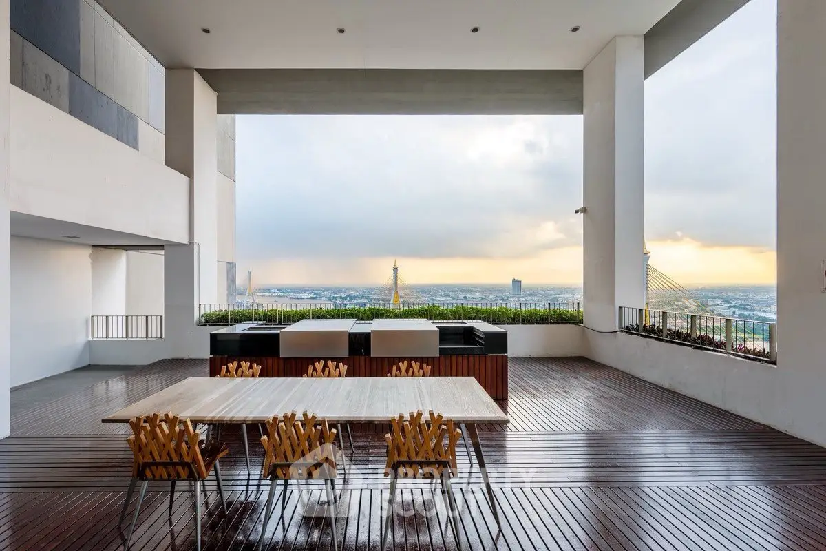 Stunning rooftop terrace with panoramic city views and elegant dining setup.