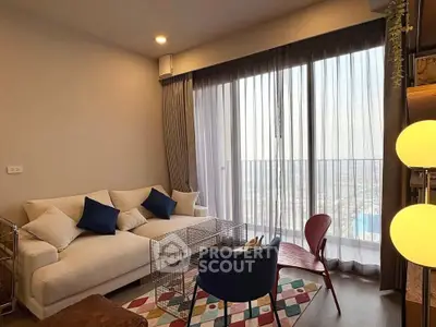 Modern living room with floor-to-ceiling windows and stylish decor