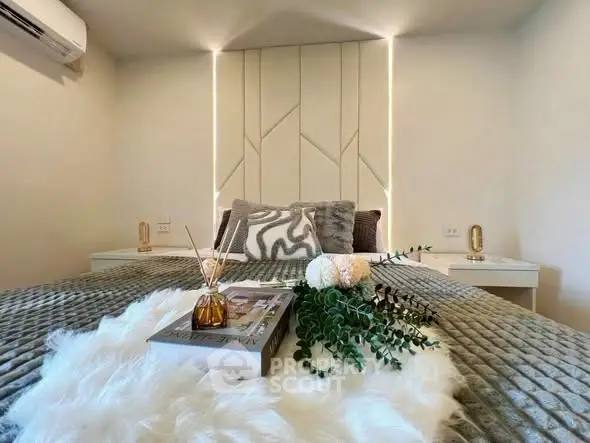 Luxurious bedroom with plush bedding and modern decor, perfect for relaxation and comfort.