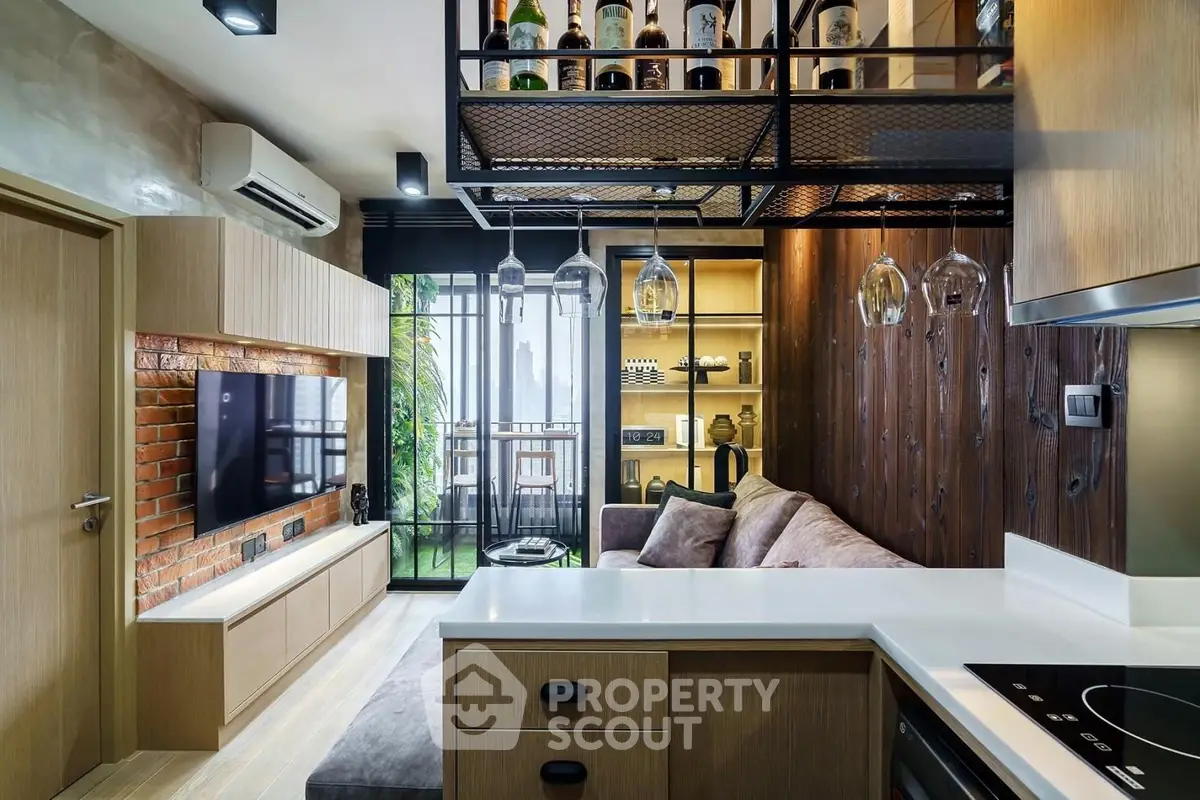Modern living room with open kitchen, stylish decor, and balcony view