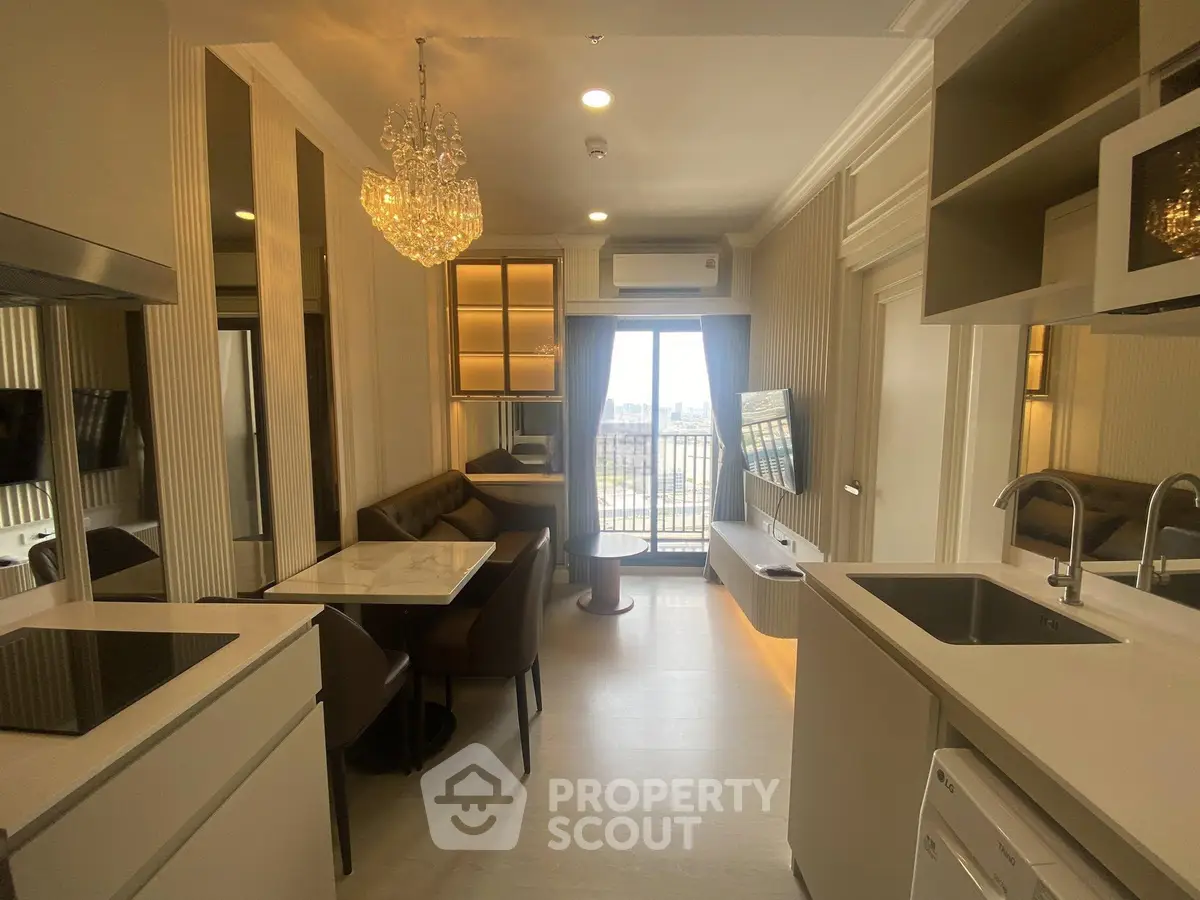 Modern open-layout kitchen and living area with balcony view in stylish apartment