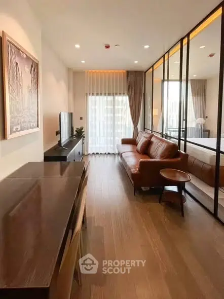 Modern living room with stylish decor and large windows in a contemporary apartment.