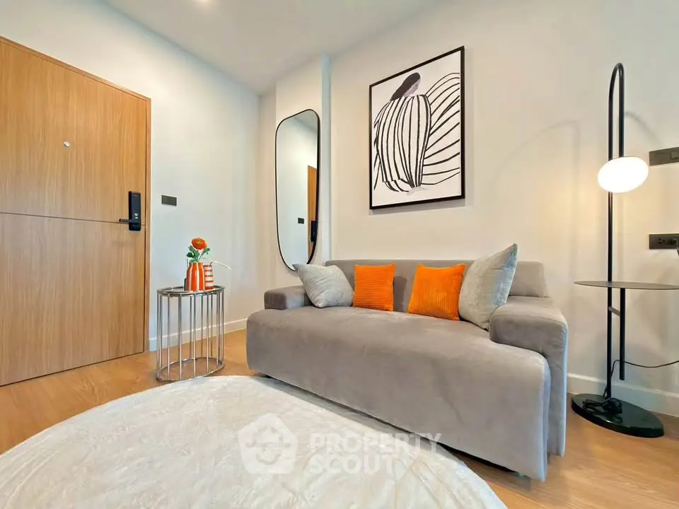 Modern living room with stylish decor and cozy seating in a contemporary apartment.