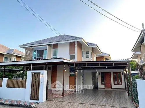 Modern two-story house with spacious driveway and contemporary design