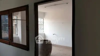 Spacious balcony area with natural light and potential for customization.