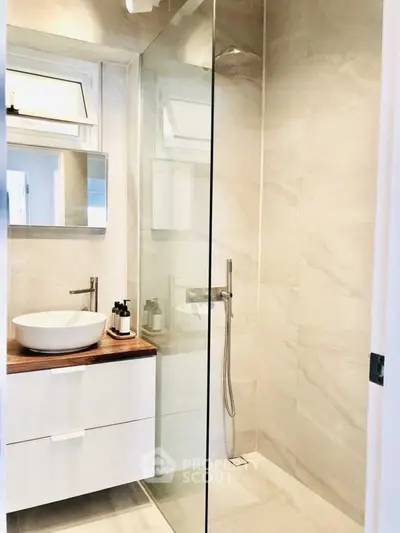 Modern bathroom with glass shower and stylish vanity