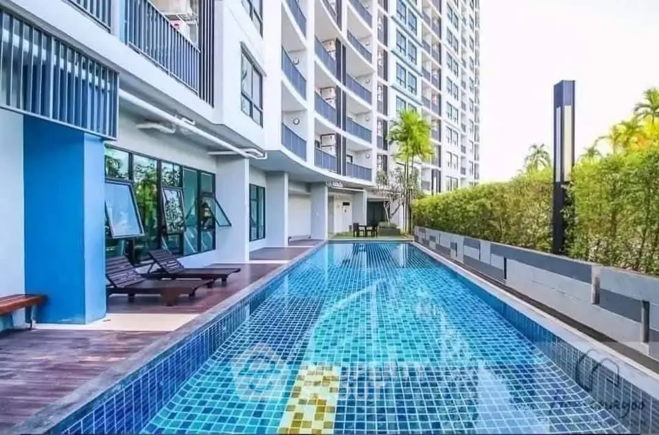 Luxurious condominium with a stunning outdoor pool and modern architecture.