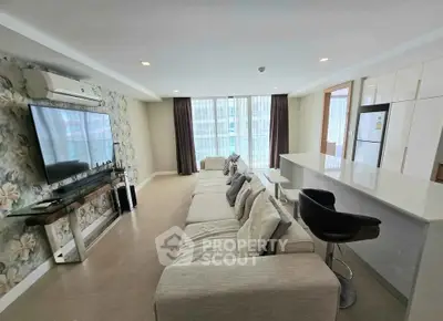 Spacious modern living room with open kitchen and stylish decor