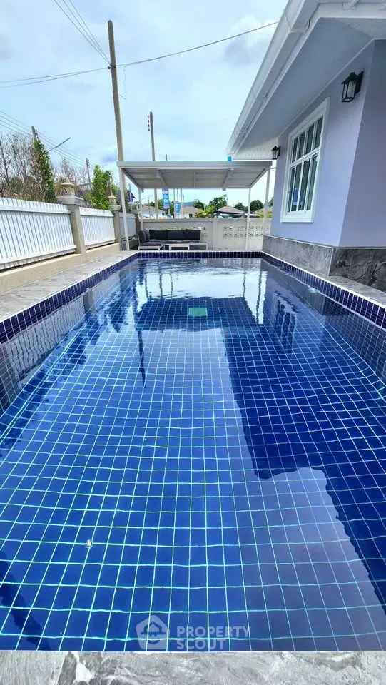 Stunning private pool with modern design and serene surroundings in a luxury property.