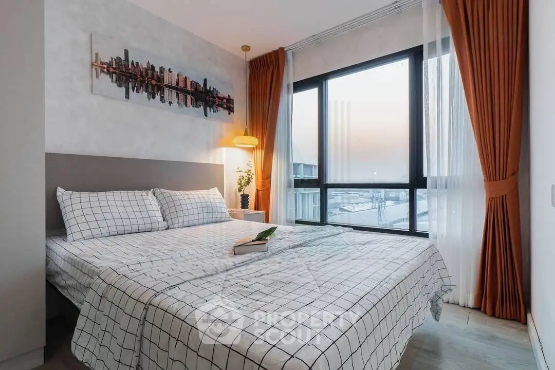 Modern bedroom with city view, stylish decor, and cozy ambiance.
