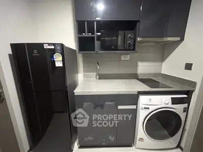 Modern compact kitchen with sleek appliances and efficient layout