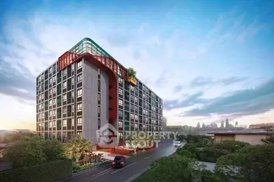 Modern urban apartment building with lush greenery and city skyline view.