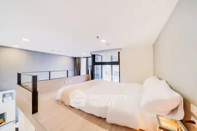 Modern loft bedroom with stylish design and large windows