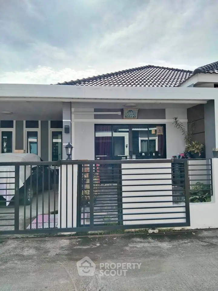 Charming single-story home with modern design and gated entrance in a serene neighborhood.