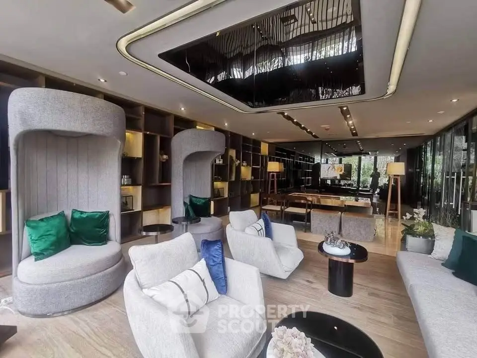 Luxurious modern living room with elegant seating and stylish decor, perfect for relaxation and entertainment.