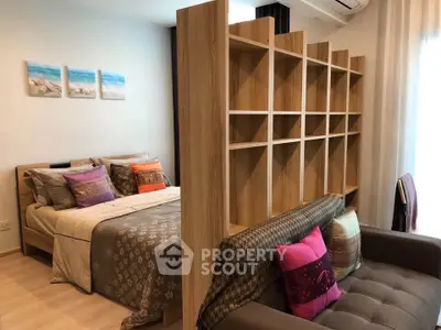 Stylish studio apartment with cozy bed and modern decor