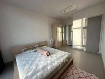 Spacious bedroom with modern design and ample natural light