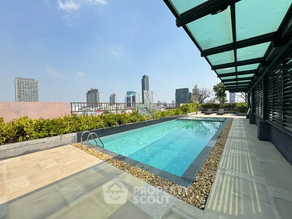 Luxurious rooftop pool with stunning city skyline views and modern design.