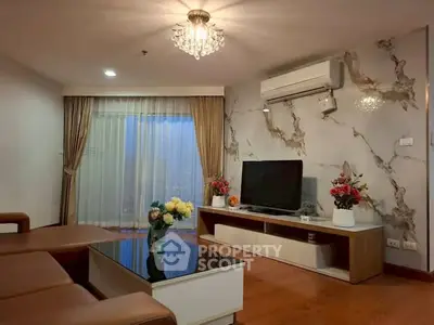 Elegant living room with modern decor and large window view