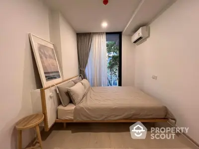 Cozy bedroom with modern minimalist design, featuring a comfortable bed, sleek wooden side table, and a serene balcony view, perfect for urban living.