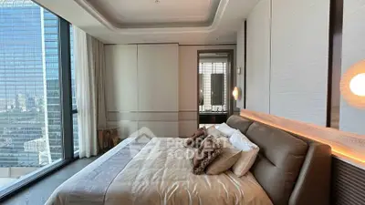 Luxurious modern bedroom with city view in high-rise apartment