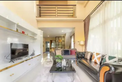 Spacious modern living room with high ceilings and elegant decor