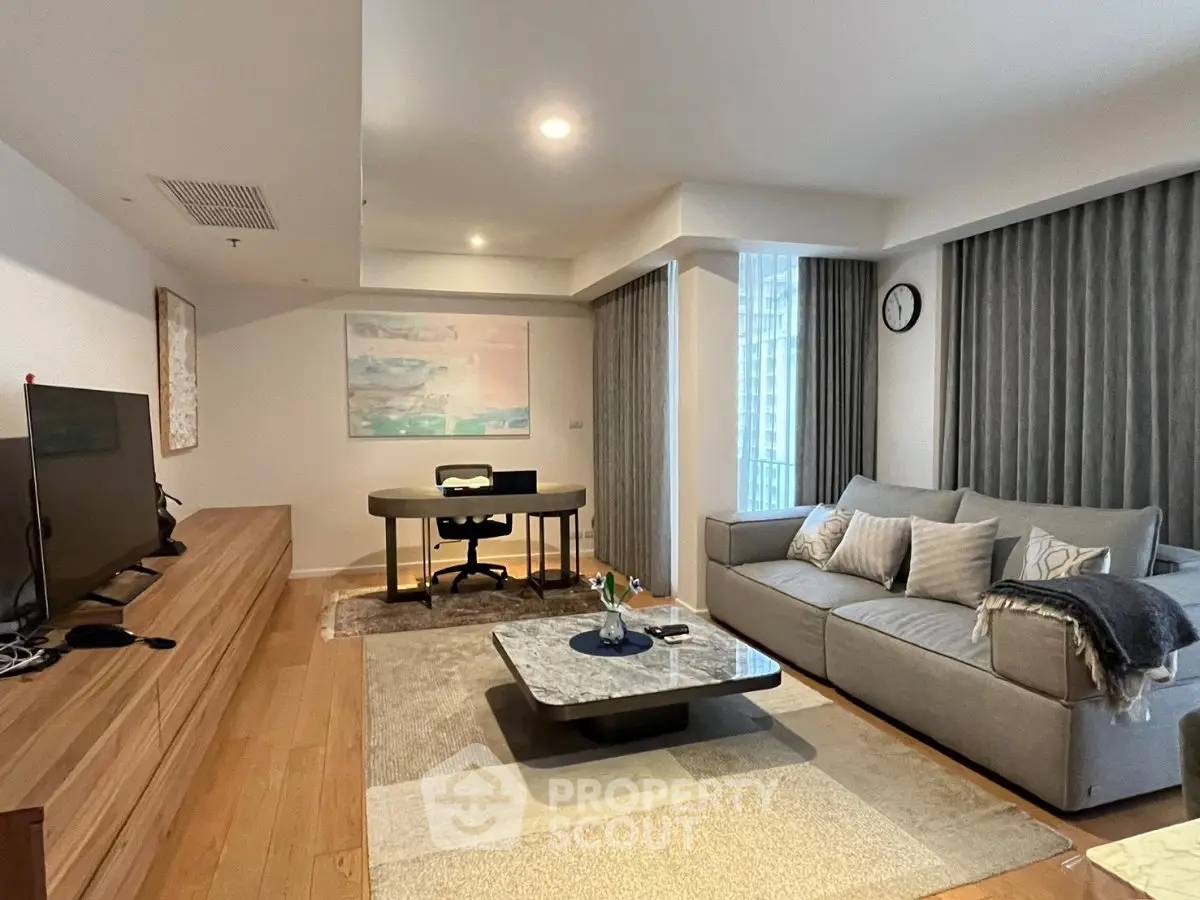 Spacious modern living room with stylish decor and natural light