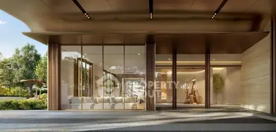 Luxurious modern building entrance with sleek design and lush greenery