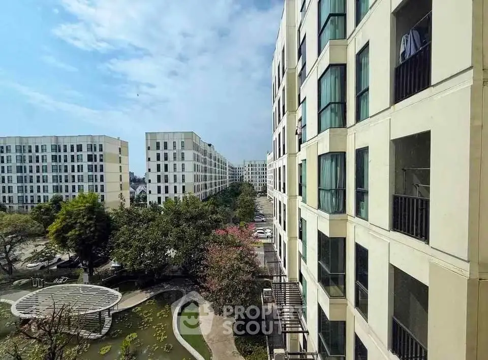 Modern apartment complex with lush gardens and spacious balconies