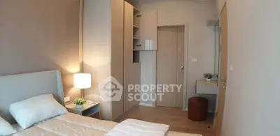 Cozy bedroom with modern furniture and soft lighting, perfect for relaxation and comfort.