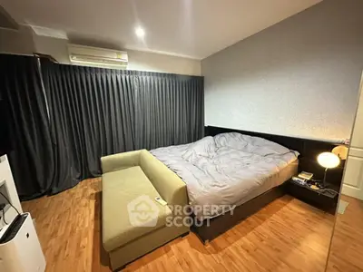 Cozy bedroom with modern decor and wooden flooring