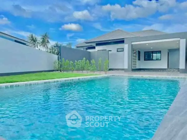 Luxurious modern home with private swimming pool and spacious outdoor area.