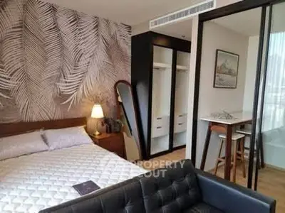 Modern bedroom with stylish decor and open layout in urban apartment.