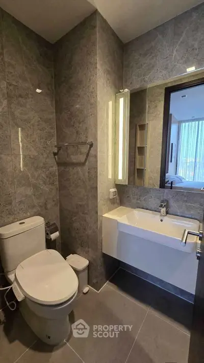 Modern bathroom with sleek design and elegant fixtures in a luxury apartment.