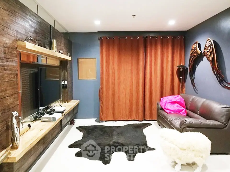 Stylish living room with modern decor, leather sofa, and unique wall art