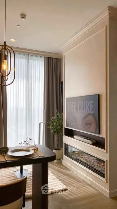 Modern living room with elegant decor, featuring a wall-mounted TV and stylish lighting.
