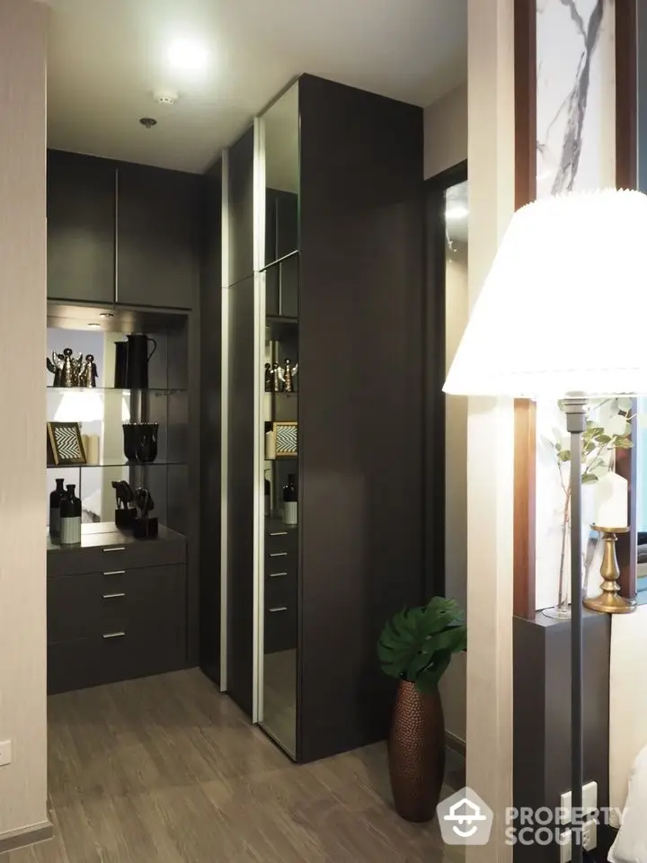 Stylish modern storage area with sleek cabinetry and elegant decor