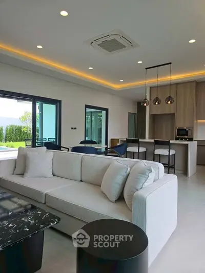 Luxurious modern living room with open kitchen and stylish decor