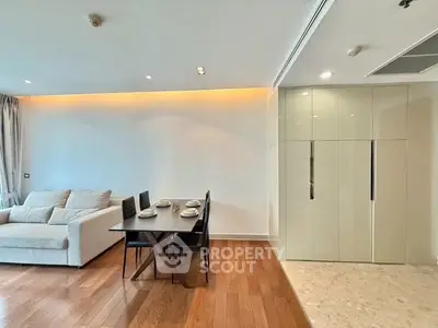 Modern living room with elegant dining area and sleek wooden flooring