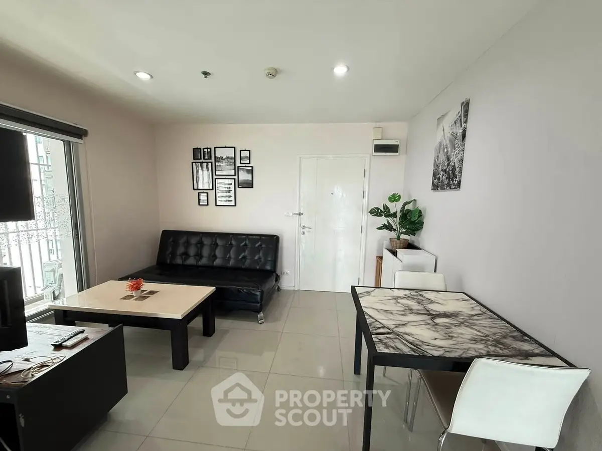 Modern living room with sleek furniture and stylish decor, perfect for urban living.