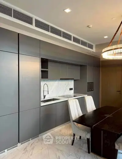 Modern kitchen with sleek cabinetry and elegant dining area