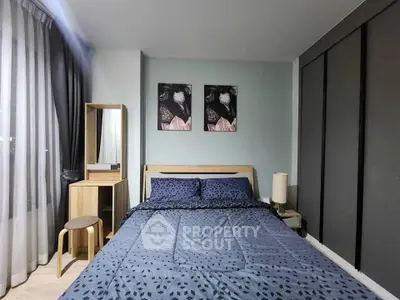 Modern bedroom with stylish decor and ample natural light