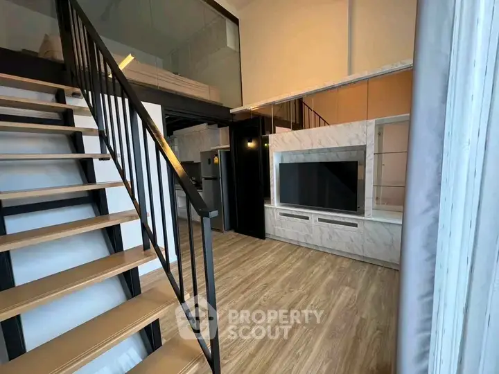 Modern loft apartment with stylish staircase and spacious living area
