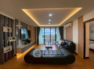 Luxurious modern living room with stylish furniture and expansive window view.