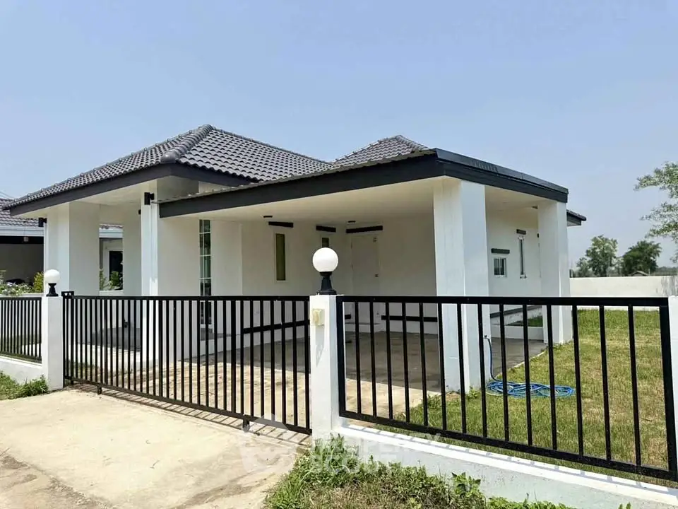 Charming single-story home with modern design and spacious yard, perfect for family living.