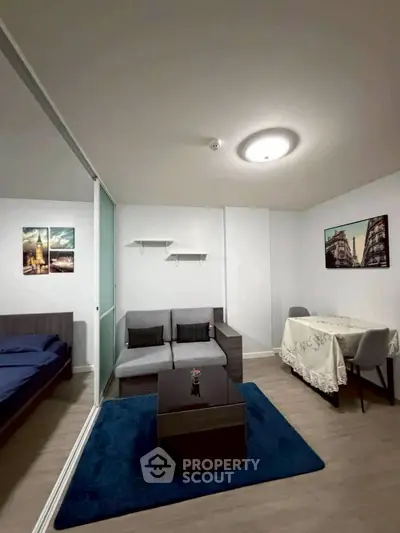 Modern living room with cozy sofa and dining area in stylish apartment