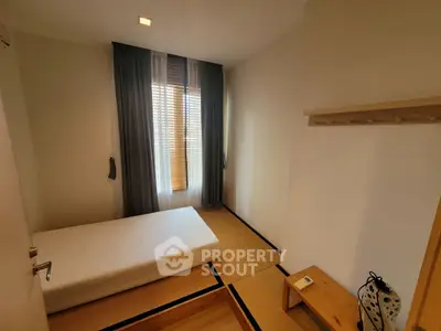 Cozy minimalist bedroom with tatami flooring and natural light