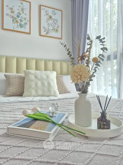 Cozy and stylish bedroom with elegant decor and natural light.