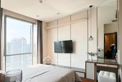 Modern bedroom with city view, featuring a wall-mounted TV and stylish decor.